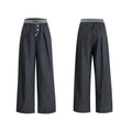 A pair of high-waisted straight-leg casual trousers in grey, showing the button-fly detail.