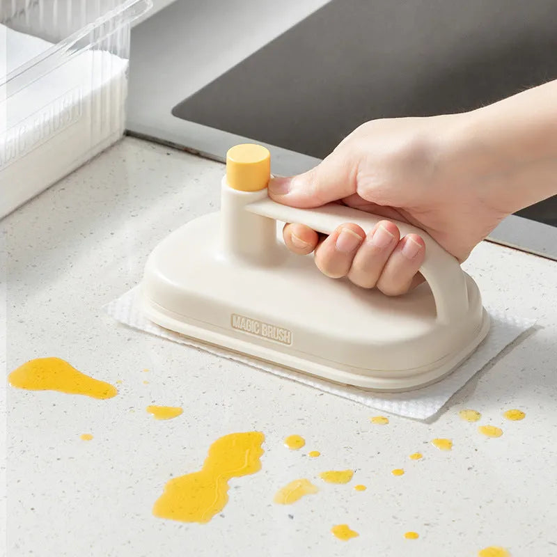 Magic Brush cleaning tool with disposable white rag heads for bathroom tile and glass cleaning.