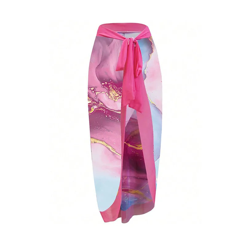 Pink printed women's one-piece swimsuit with a sheath silhouette and attached skirt.