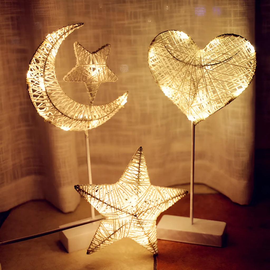 Rattan and copper wire LED table lamp in star, love heart, or moon shape for bedroom decoration.