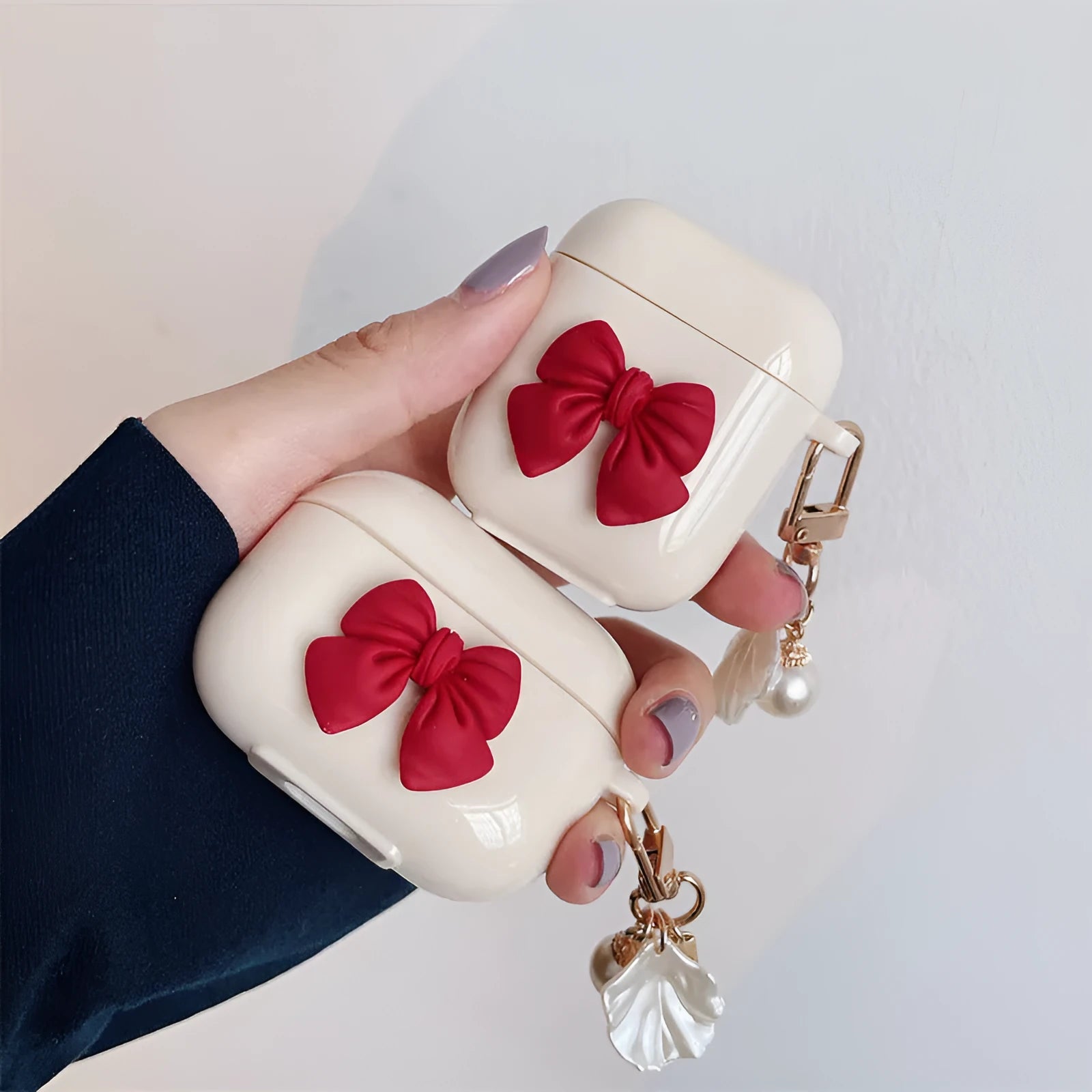Beige TPU case with a red bow for AirPods and AirPods Pro wireless earphones
