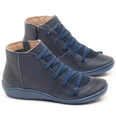 Women's casual flat ankle boots in artificial PU leather with a round toe and wedge rubber sole.
