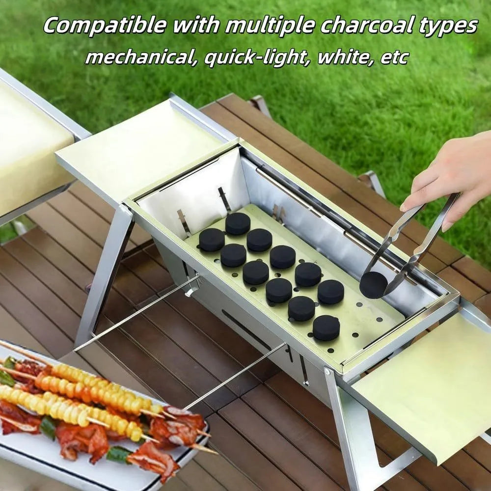 Small foldable steel charcoal grill for portable outdoor cooking.