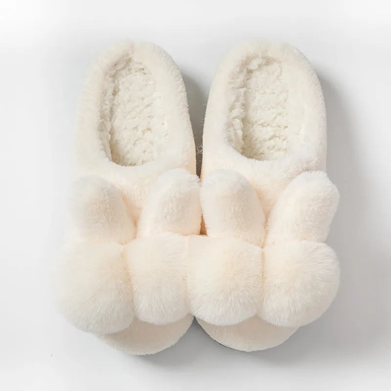 Women's high-top rabbit fur slipper in creamy white with floral detail and low heel.