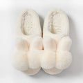 Women's high-top rabbit fur slipper in creamy white with floral detail and low heel.