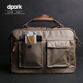 Dpark black 14 inch laptop bag with single shoulder strap showing padded compartment and organisation pockets