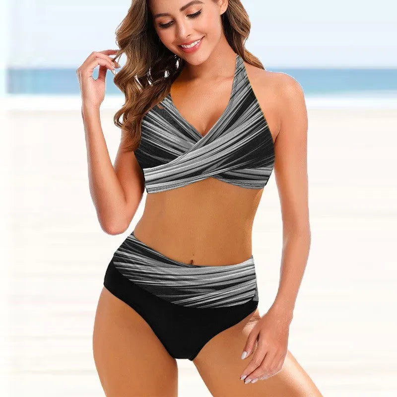 A striped tie-dye ladies bikini set with a backless top and high-waisted briefs on a mannequin.