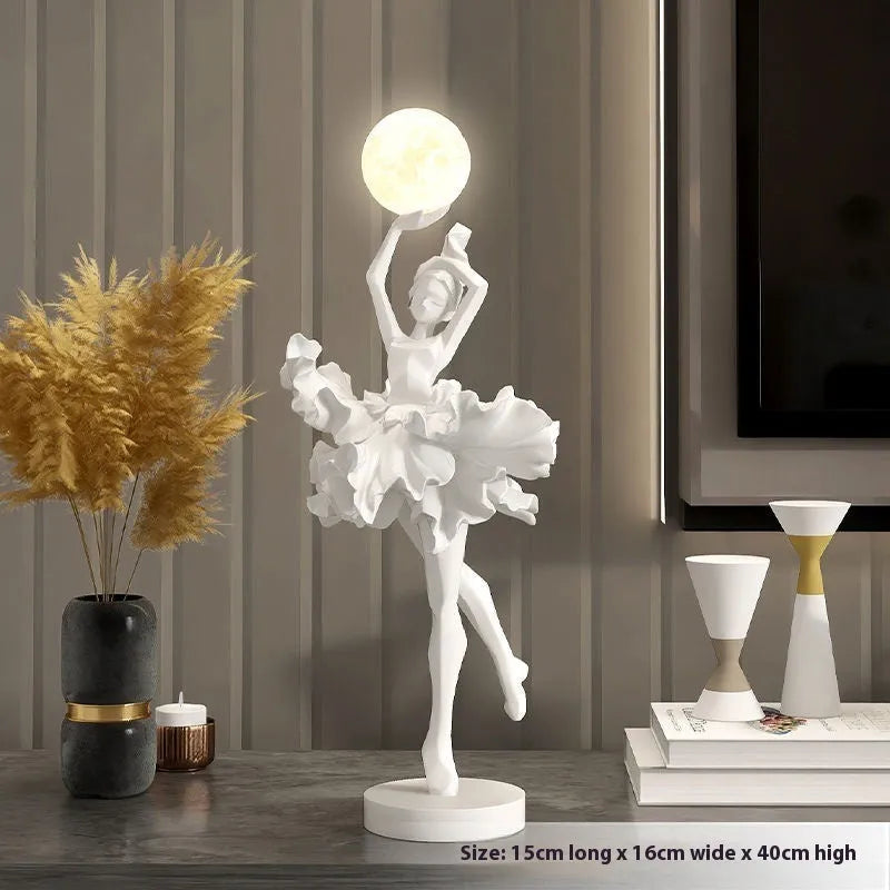 Small modern resin night light ornament with USB cable in black gold colour.
