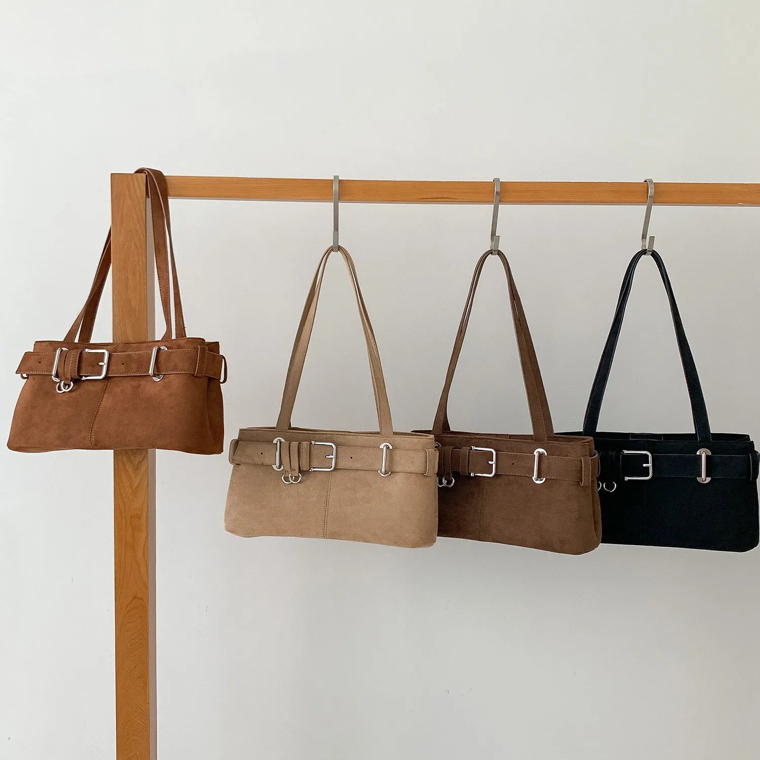 Retro minority design underarm bag in apricot colour with horizontal square shape and double shoulder straps.