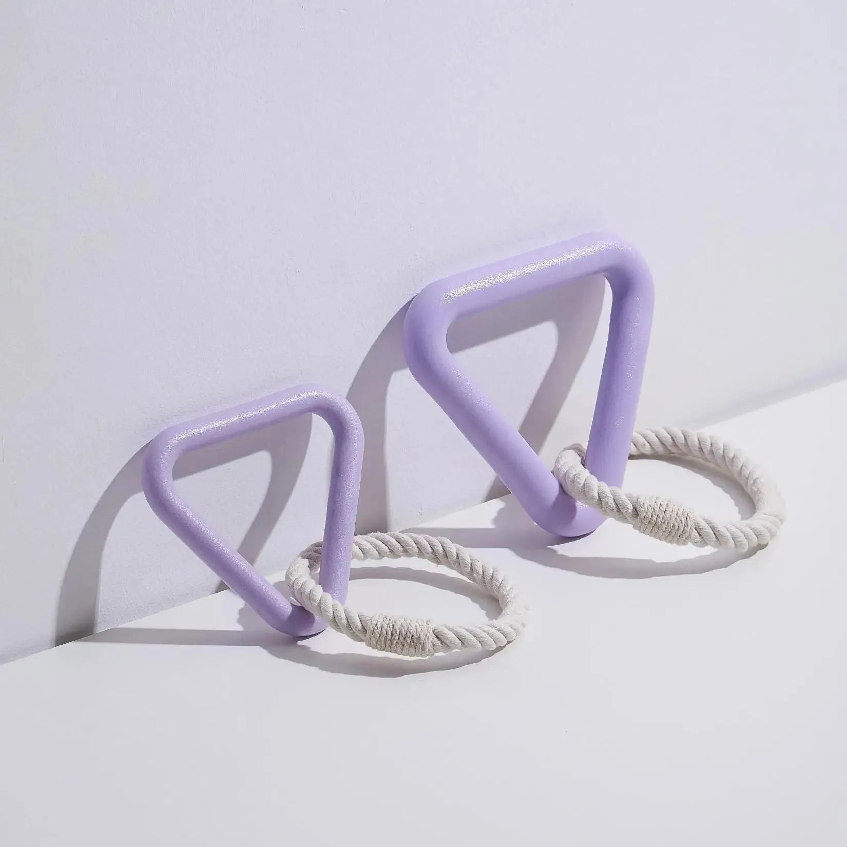 Large triangular pet pull ring toy made from cotton rope in beige, pink, or purple colour.