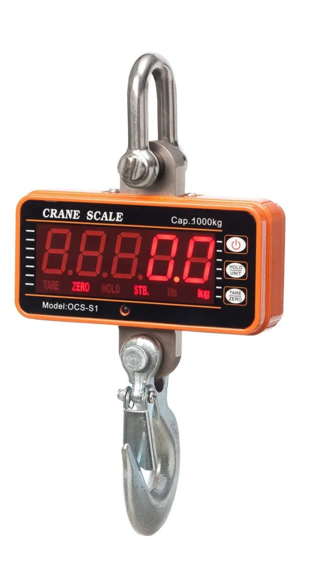 Orange electronic crane scale with digital display for 500 kg loads in warehouse.