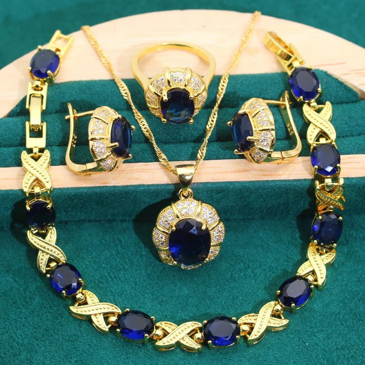 18k gold plated jewellery set with multi-colour cubic zirconia stones, showing necklace, earrings, ring, and bracelet.