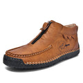 Men's black slip-on loafers with round toe and rubber sole on a plain background.