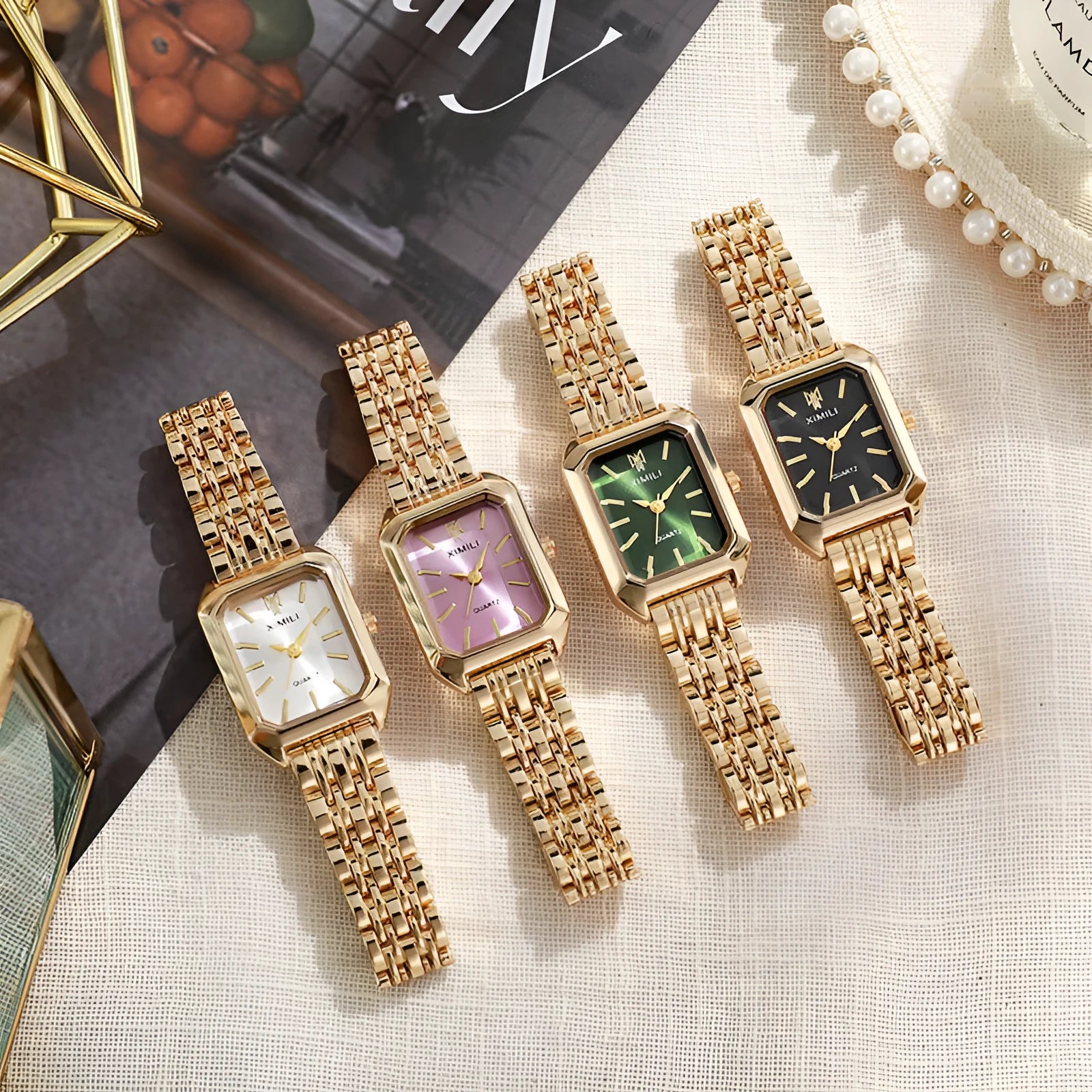 Simple square women's watch with alloy strap, quartz movement, and silver case on a white background