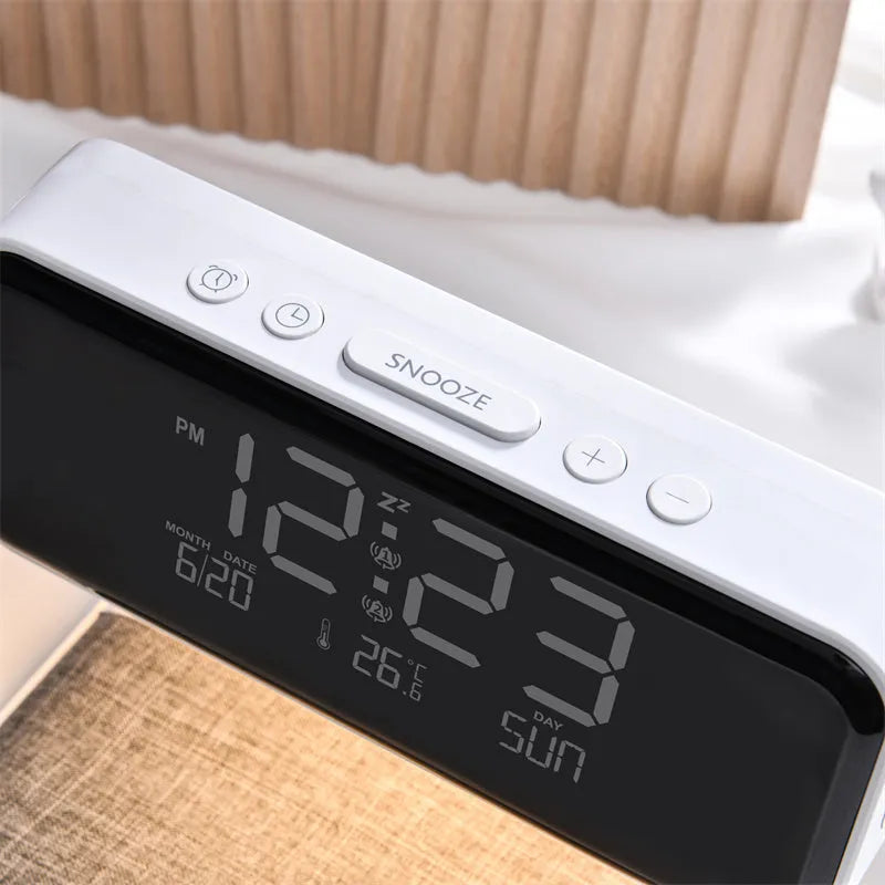 White 3-in-1 bedside lamp with wireless charging pad, LCD clock display, and touch controls.