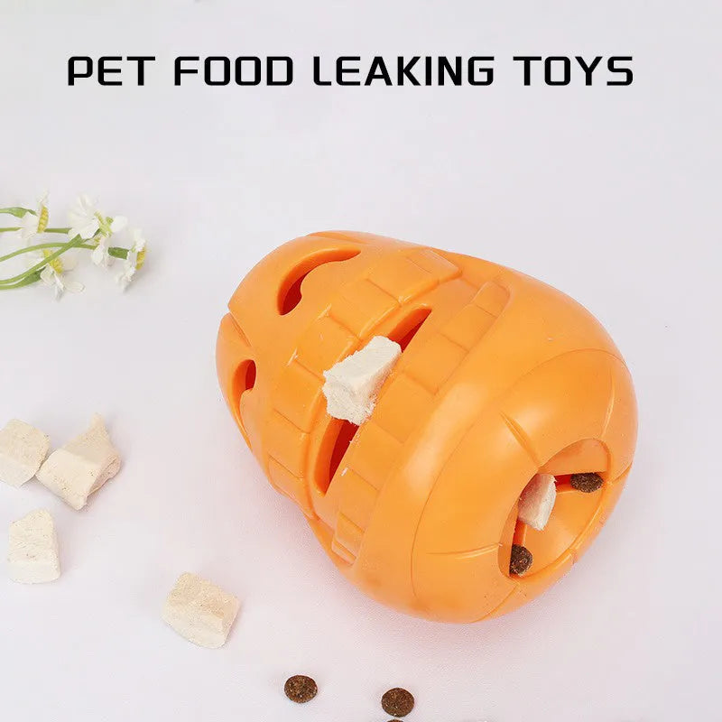 Orange Halloween pumpkin-shaped dog chew toy with a treat-dispensing funnel hole.
