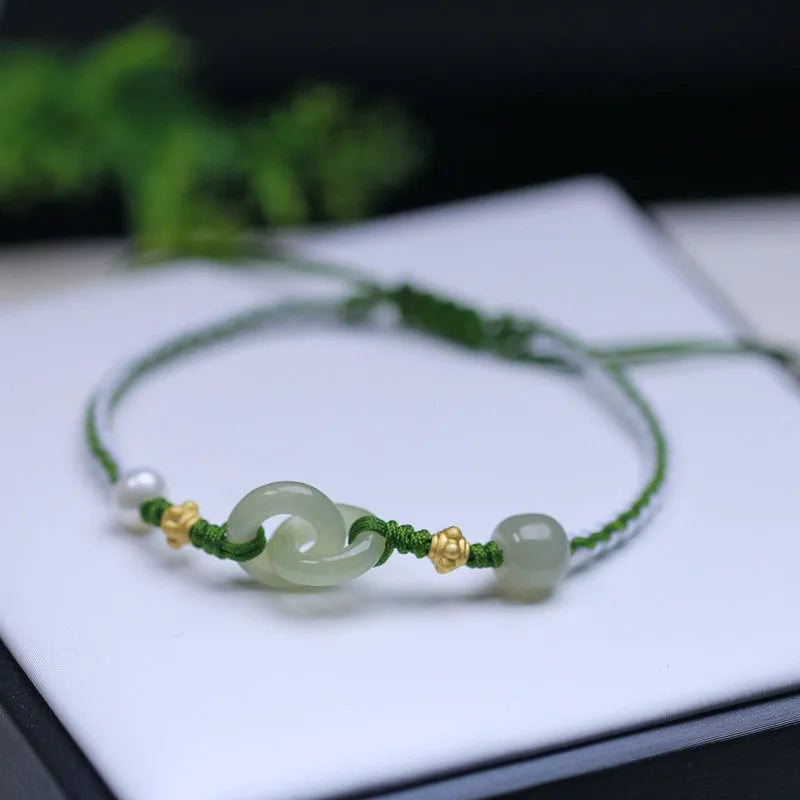Hetian jade woven bracelet with flexible wire and hollow-out metallic elements