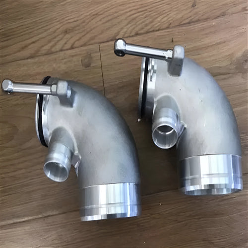 Aluminium alloy 90 degree turbo turbine elbow for lateral engine positioning automotive application