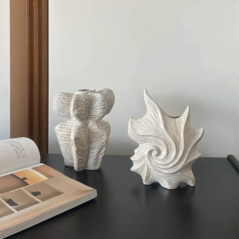 French-style retro ceramic vase with coloured glaze in a European decorative design.