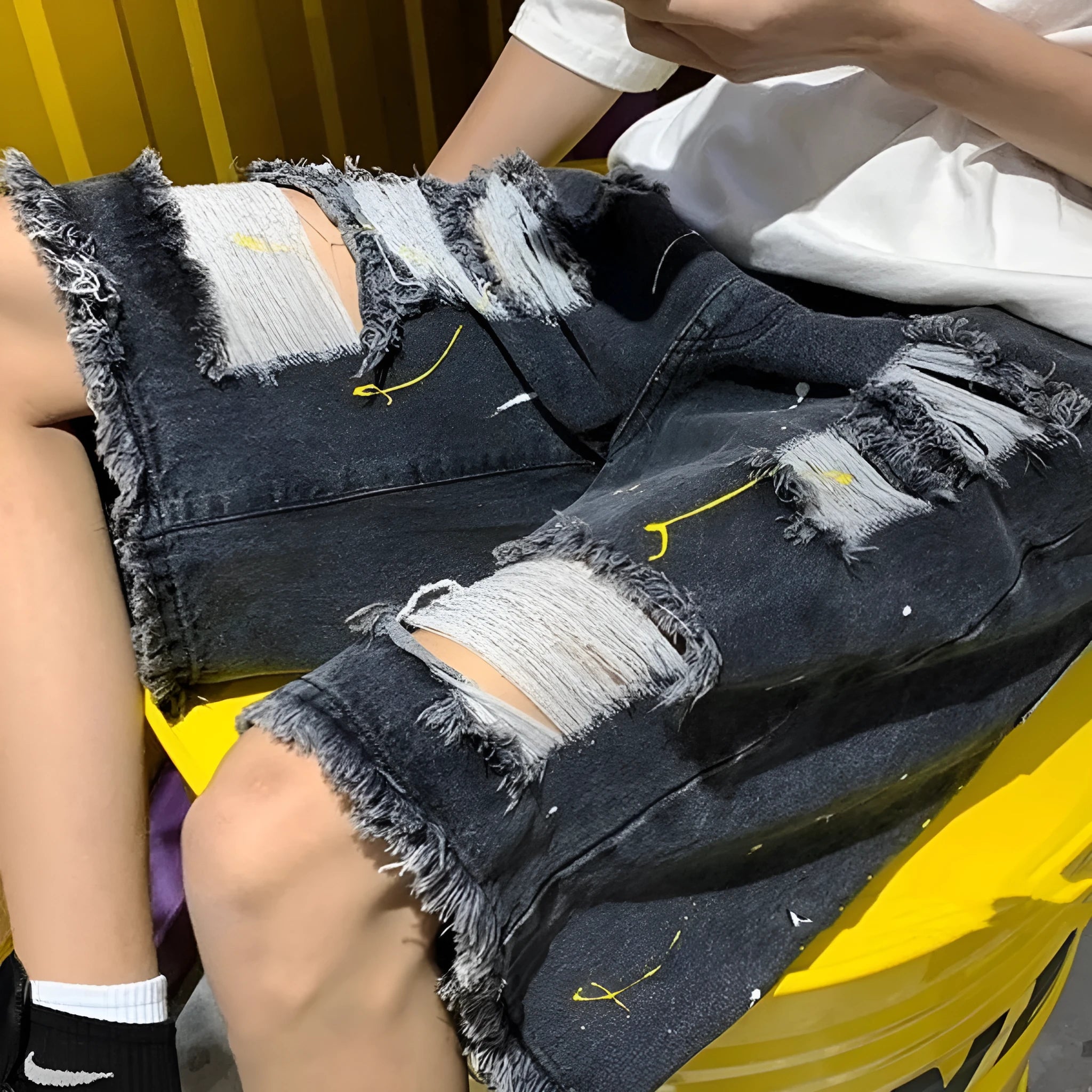 Men's black water washed hole denim shorts with loose fit and casual street style