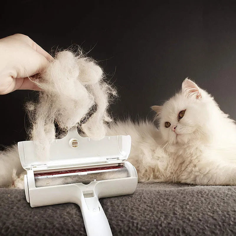 White reusable pet hair remover roller on fabric furniture
