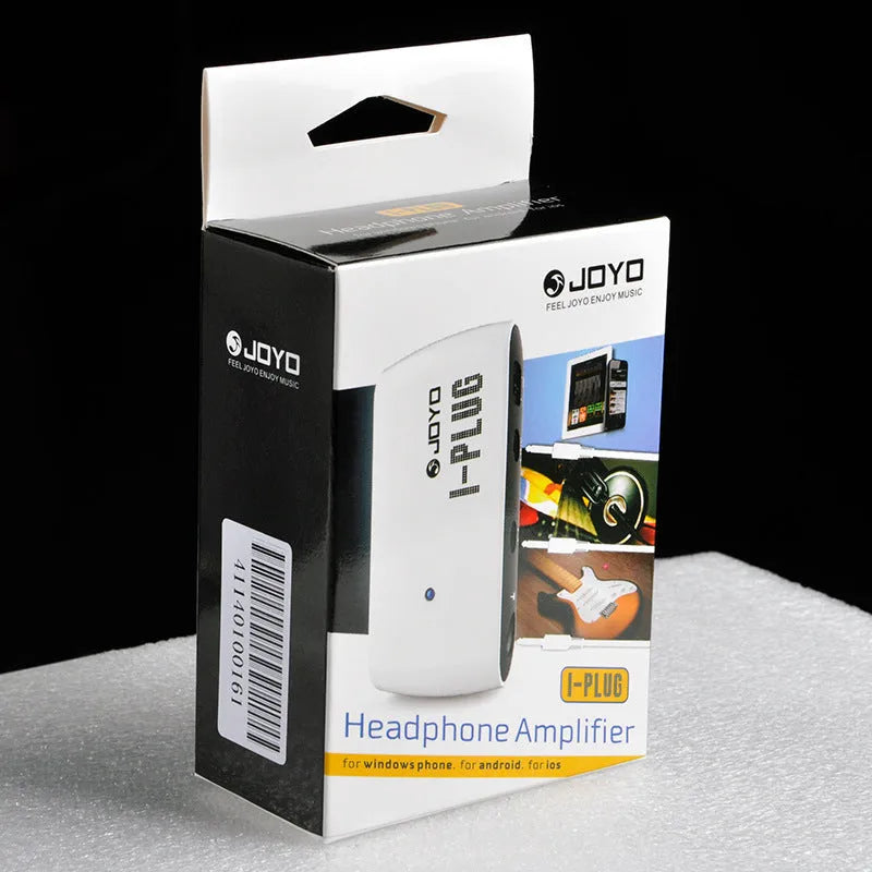 White metal portable headphone amplifier with multi-effects distortion, shown with batteries and connector.