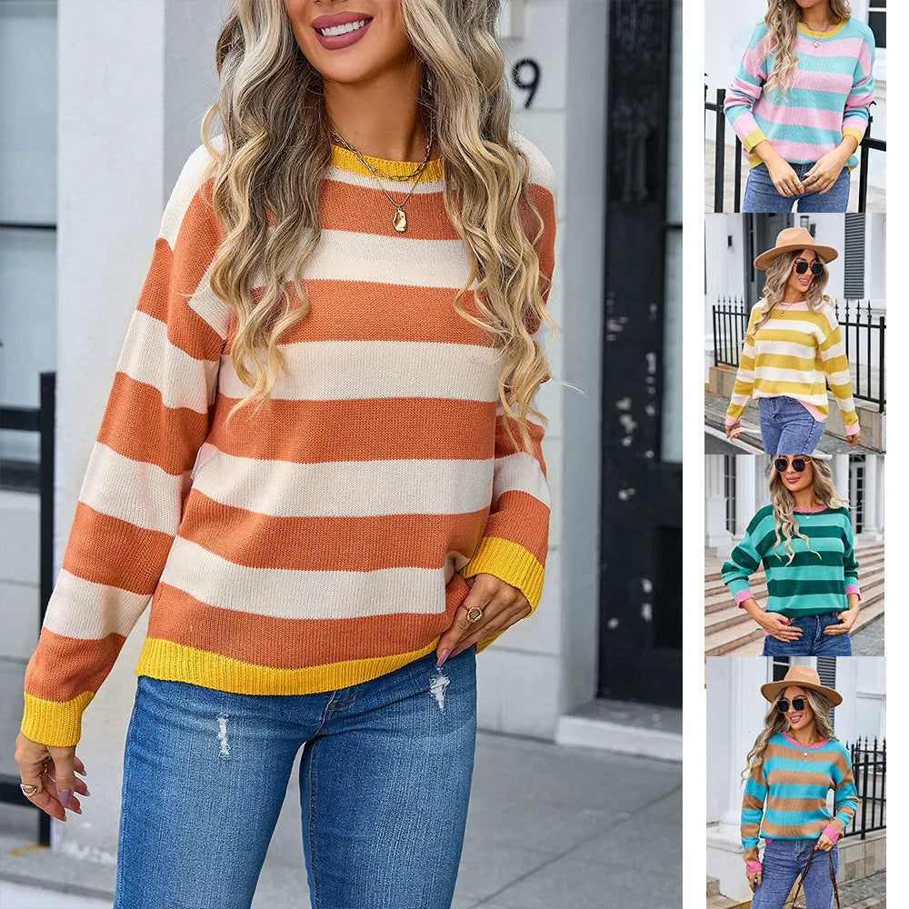 Women's loose blue acrylic sweater with stripes, round neck, and long sleeves on a hanger.