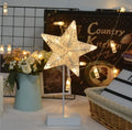 Rattan and copper wire LED table lamp in star, love heart, or moon shape for bedroom decoration.