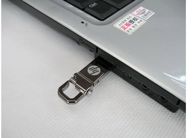 Metal USB flash drive with custom corporate logo, 48.6mm length, on a white background