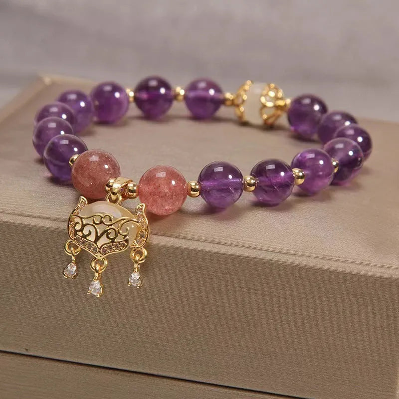 Women's copper bracelet with natural amethyst longevity lock charm and retro design elements