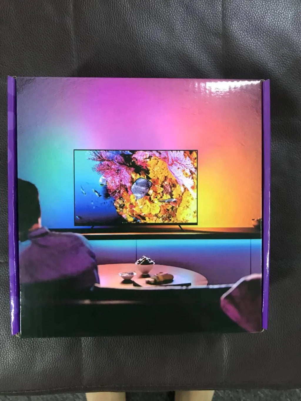 Smart TV atmosphere graffiti effect light with 60 LED beads per metre, sync box, and pure copper HDIM cable behind TV