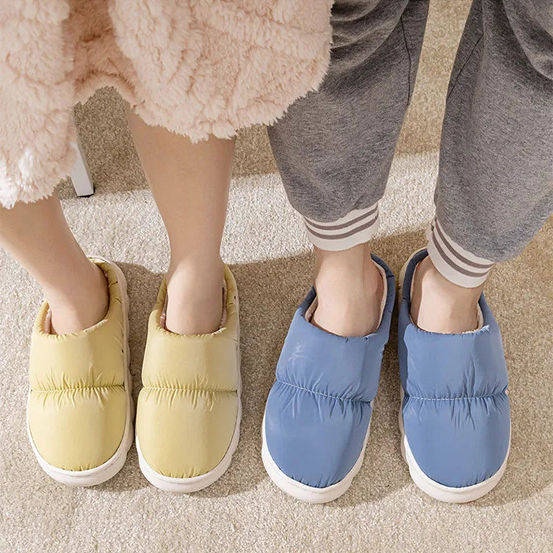A pair of down cotton indoor slippers with a thick rubber sole and plush lining, shown in a choice of colours.