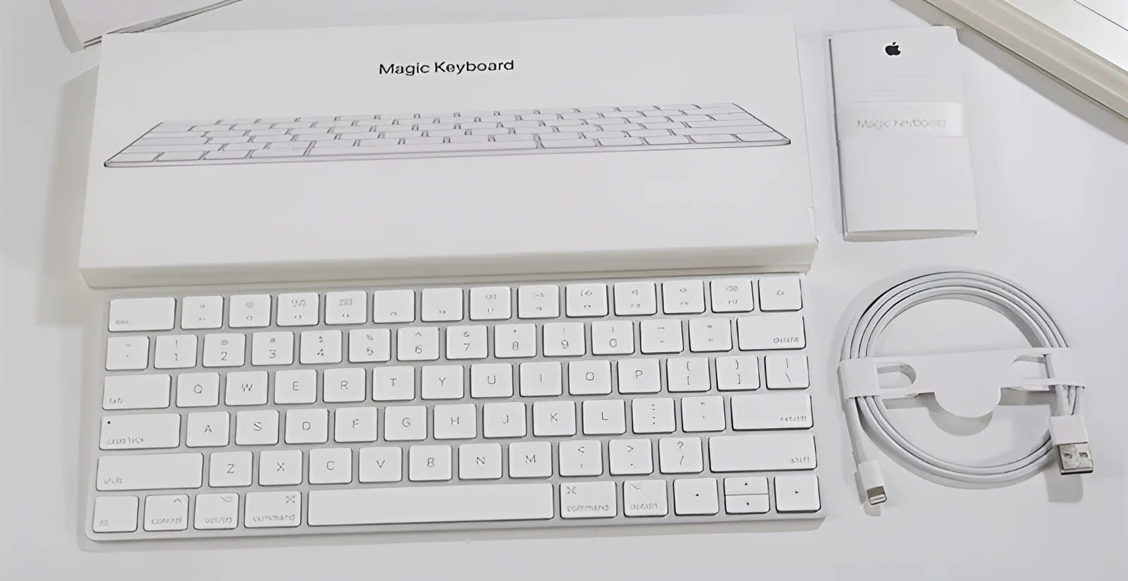 Apple white metal Bluetooth wireless keyboard with ultra-thin design and multimedia function keys