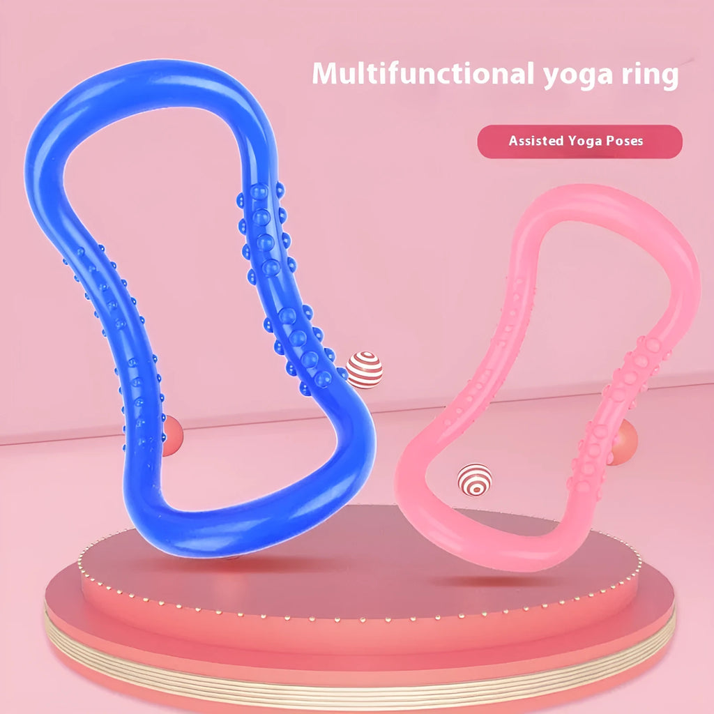 A purple PP plastic yoga ring or Pilates stretching roller on a plain background.