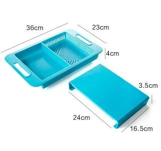 Blue kitchen chopping board with built-in sink drain basket and TPE handle on a counter.