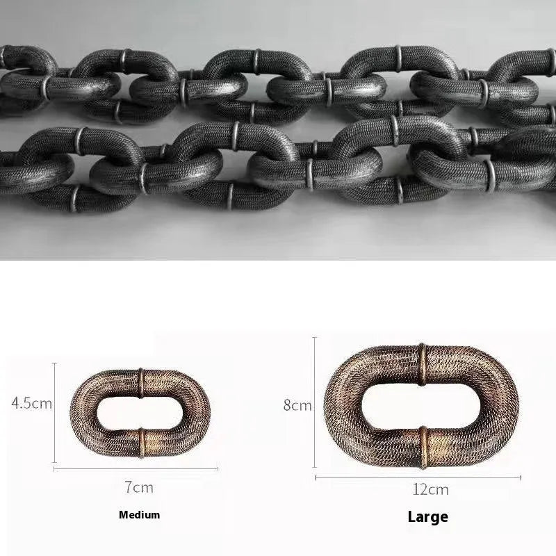 Large bronze coloured plastic dog leash prop on a white background.