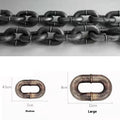 Large bronze coloured plastic dog leash prop on a white background.