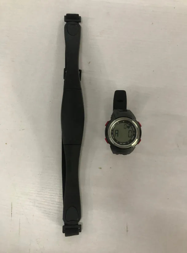 Black heart rate monitor watch with rubber strap and round dial, waterproof to 3 metres with chest strap