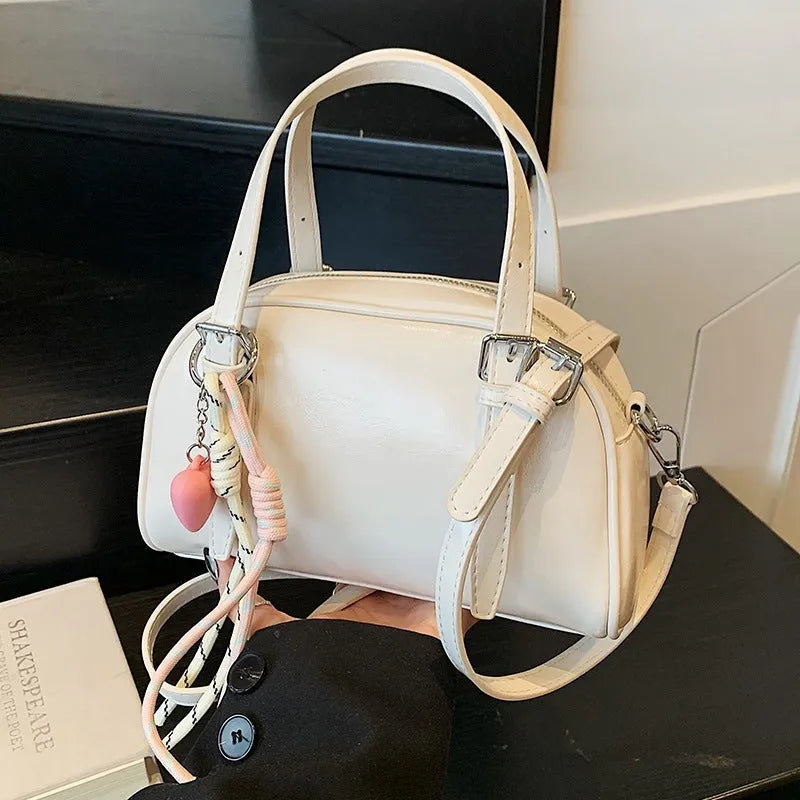 Korean style shell-shaped small square women's shoulder bag in soft PU material with pendant option