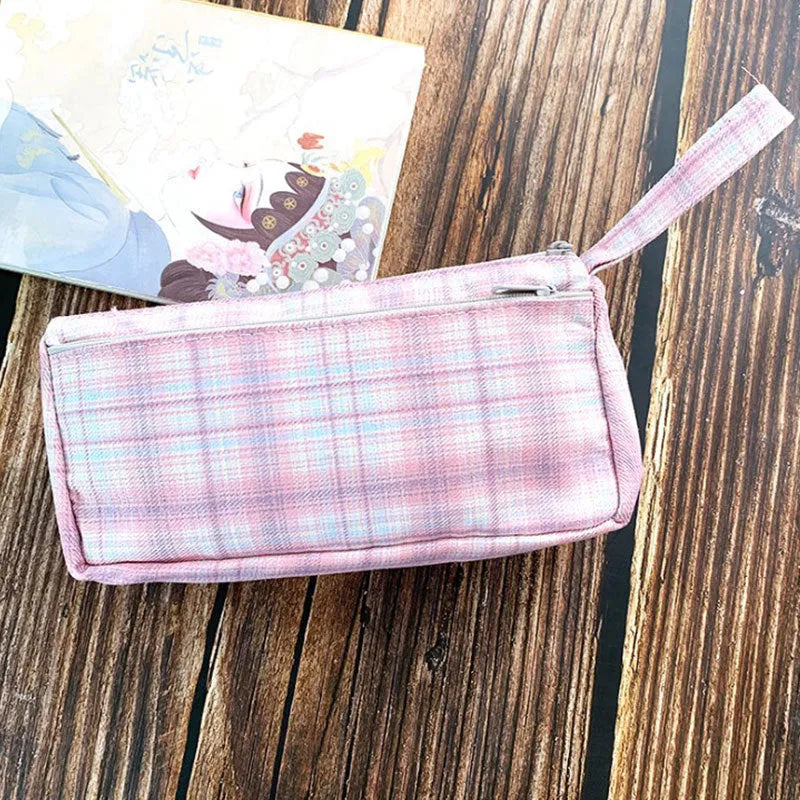 Square double-layer canvas stationery bag in a red stripe grid pattern.
