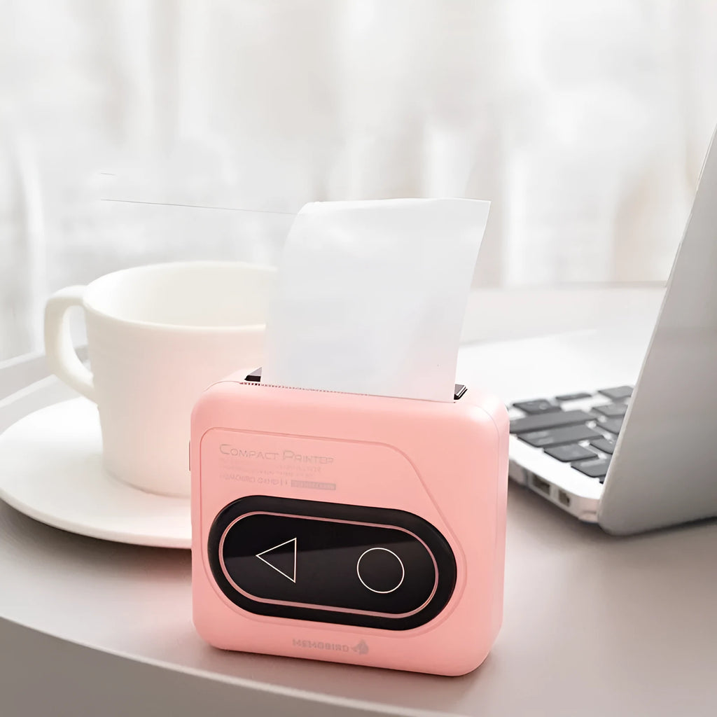 Portable Bluetooth mini printer with thermal paper in avocado green, pink, small yellow duck, and white options