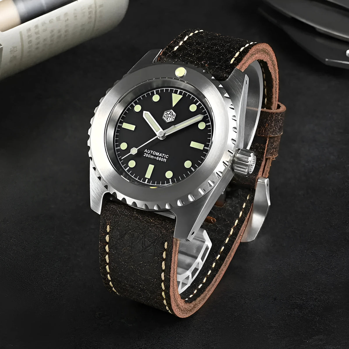 Men's stainless steel automatic diving watch with black dial, green luminous markers, leather strap, 41mm case, 200m water resistant
