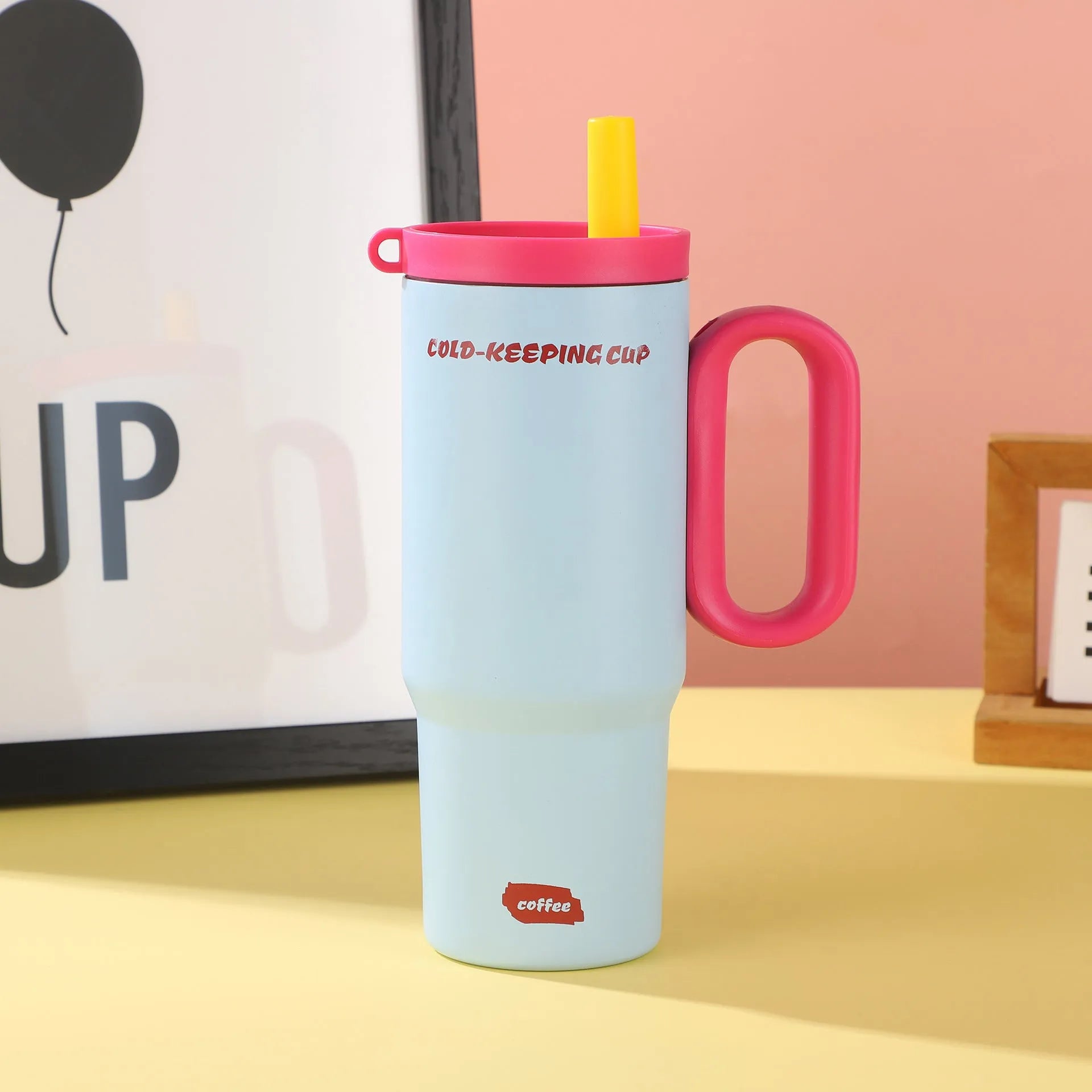 Large insulated plastic straw cup with a carry handle in a choice of five colours.