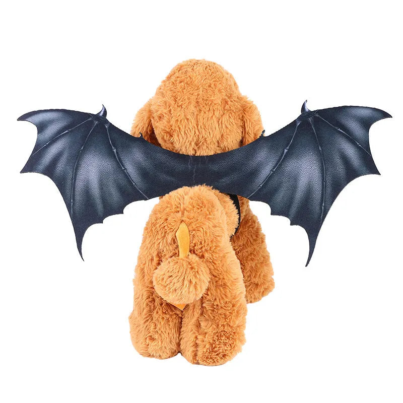 Black cloth bat wings costume accessory for a dog or cat on a Halloween background.