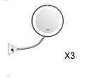 White 10x magnifying LED makeup mirror with gooseneck and suction base on a countertop