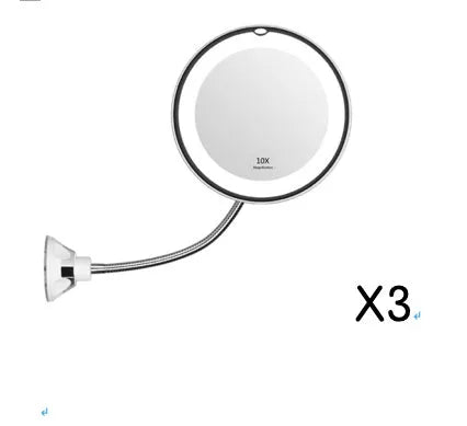 White 10x magnifying LED makeup mirror with gooseneck and suction base on a countertop