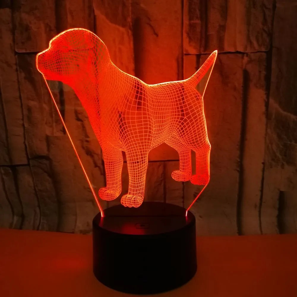 Dog-shaped USB mood lamp showing 7 colours with touch and remote control on a bedside table