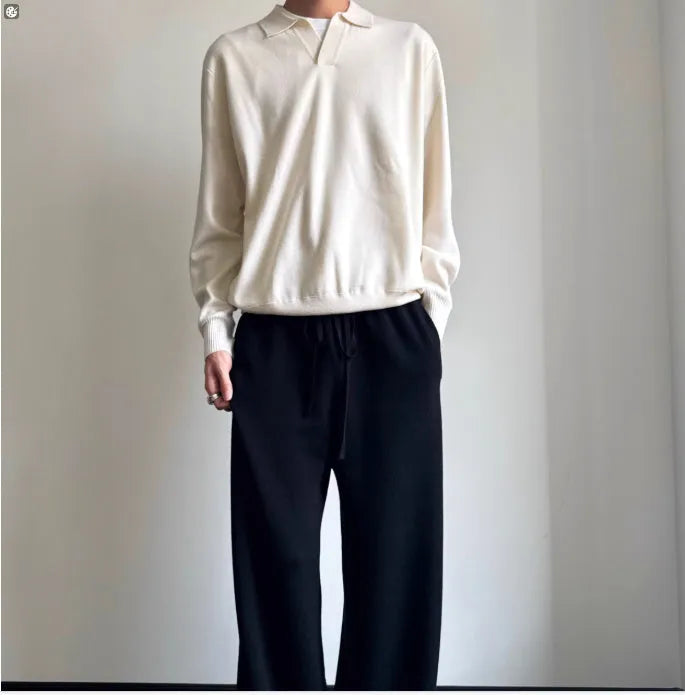 Man's pure wool polo sweater with lapel collar in loose fit, shown in milky white.