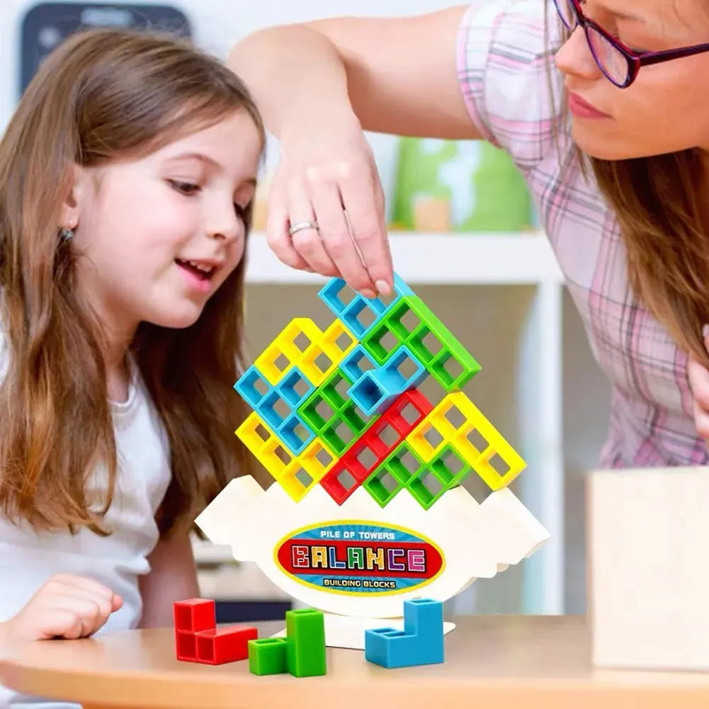 Plastic balance stacking game with 16 colourful building blocks on chassis for children aged 3+