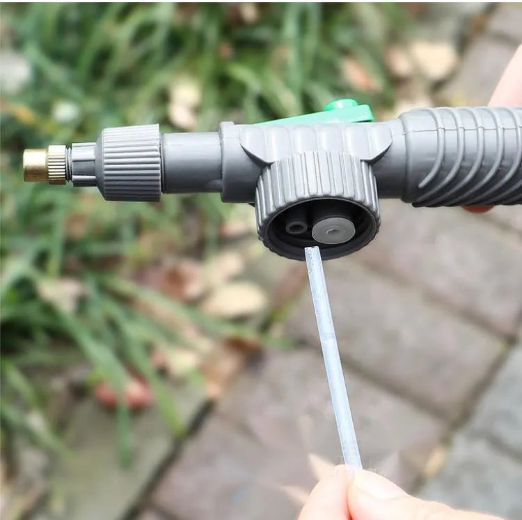 Grey watering sprayer nozzle attached to plastic bottle with 30cm connecting tube for garden watering